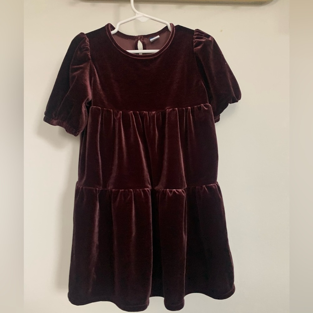 A plum colored girls short sleeve party dress